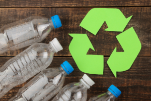 Plastic bottles around a recycling symbol